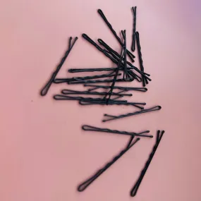 Bobby pins in Plastic container