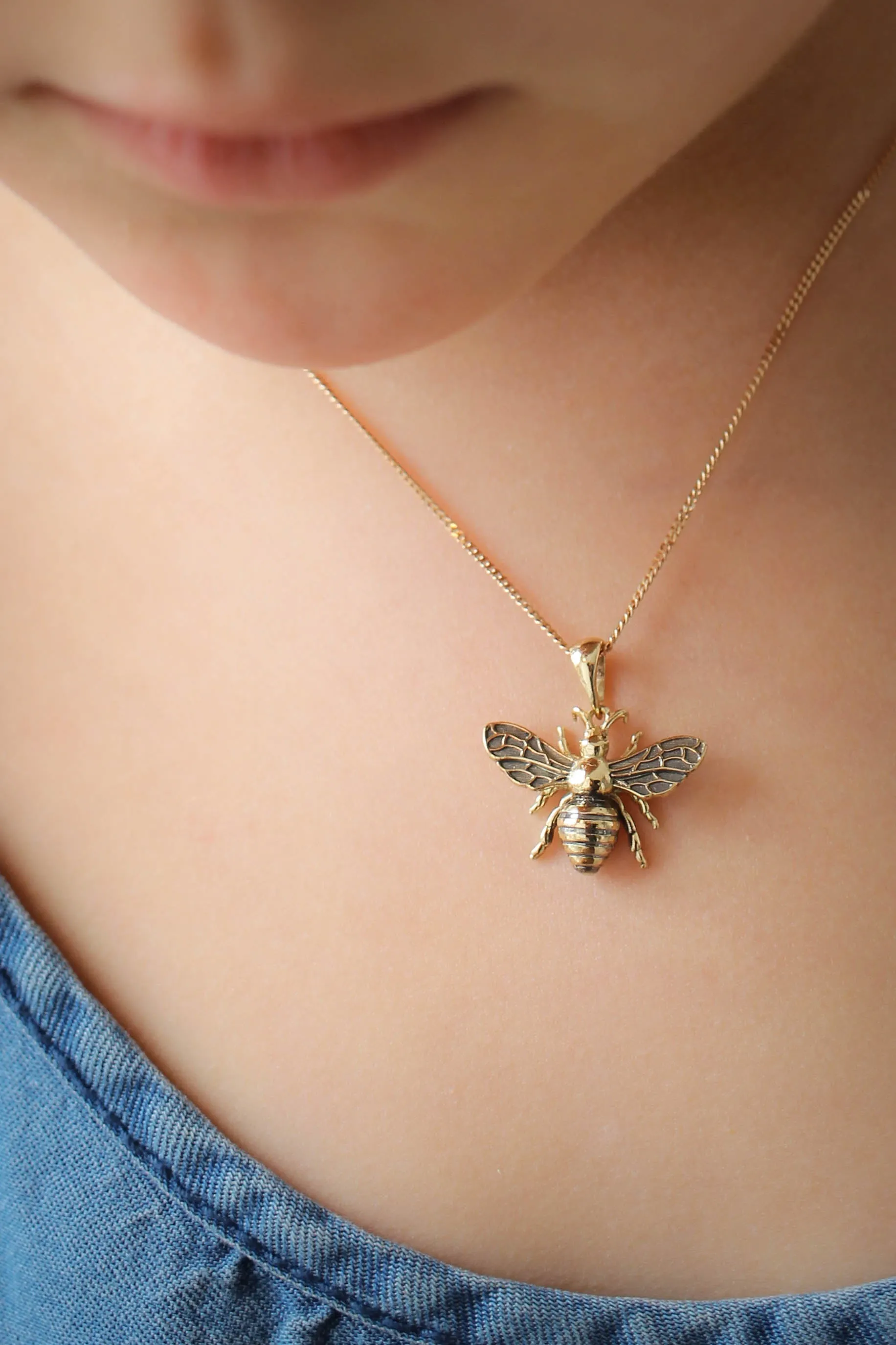 Gold bee pendant