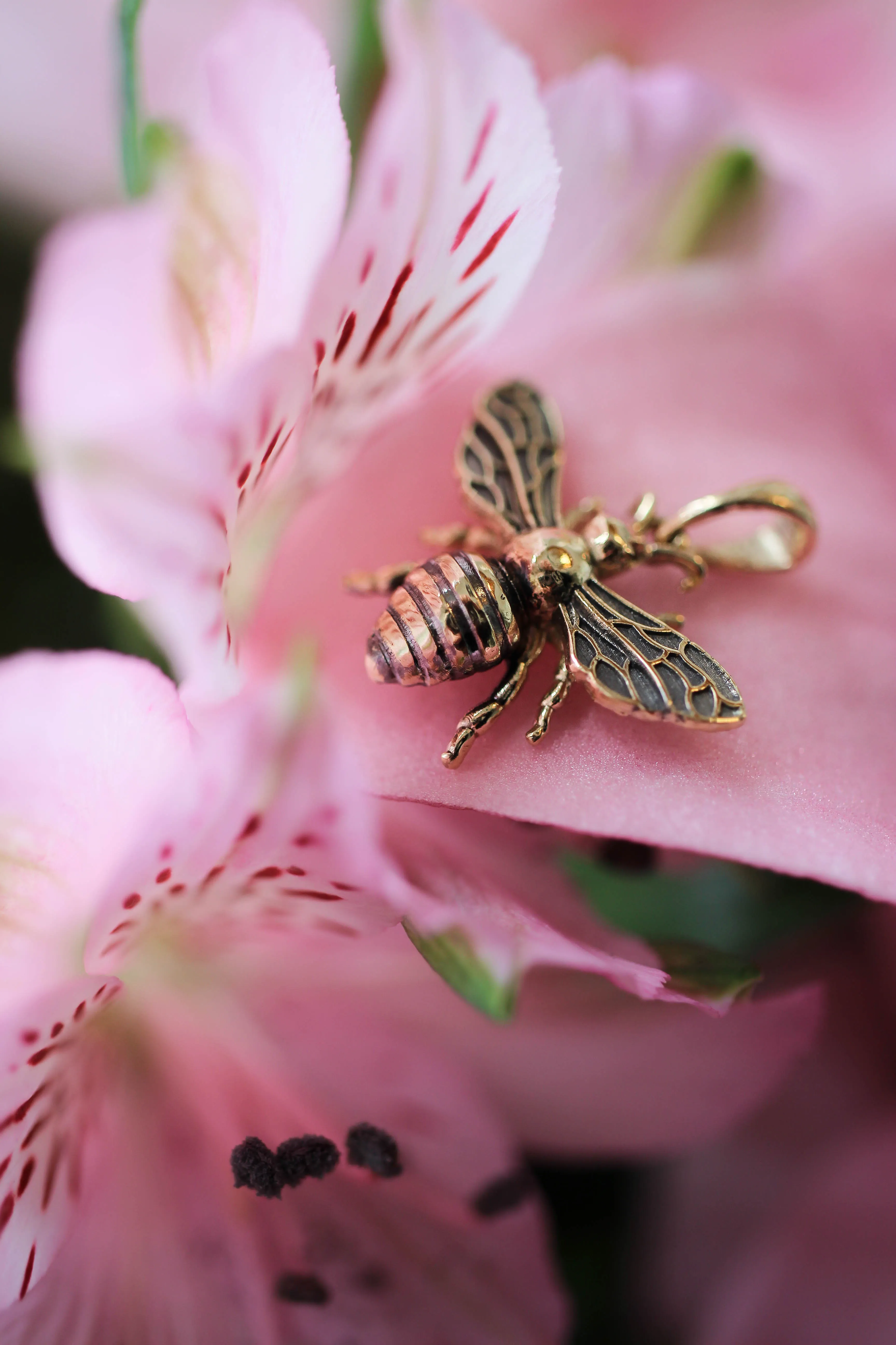 Gold bee pendant