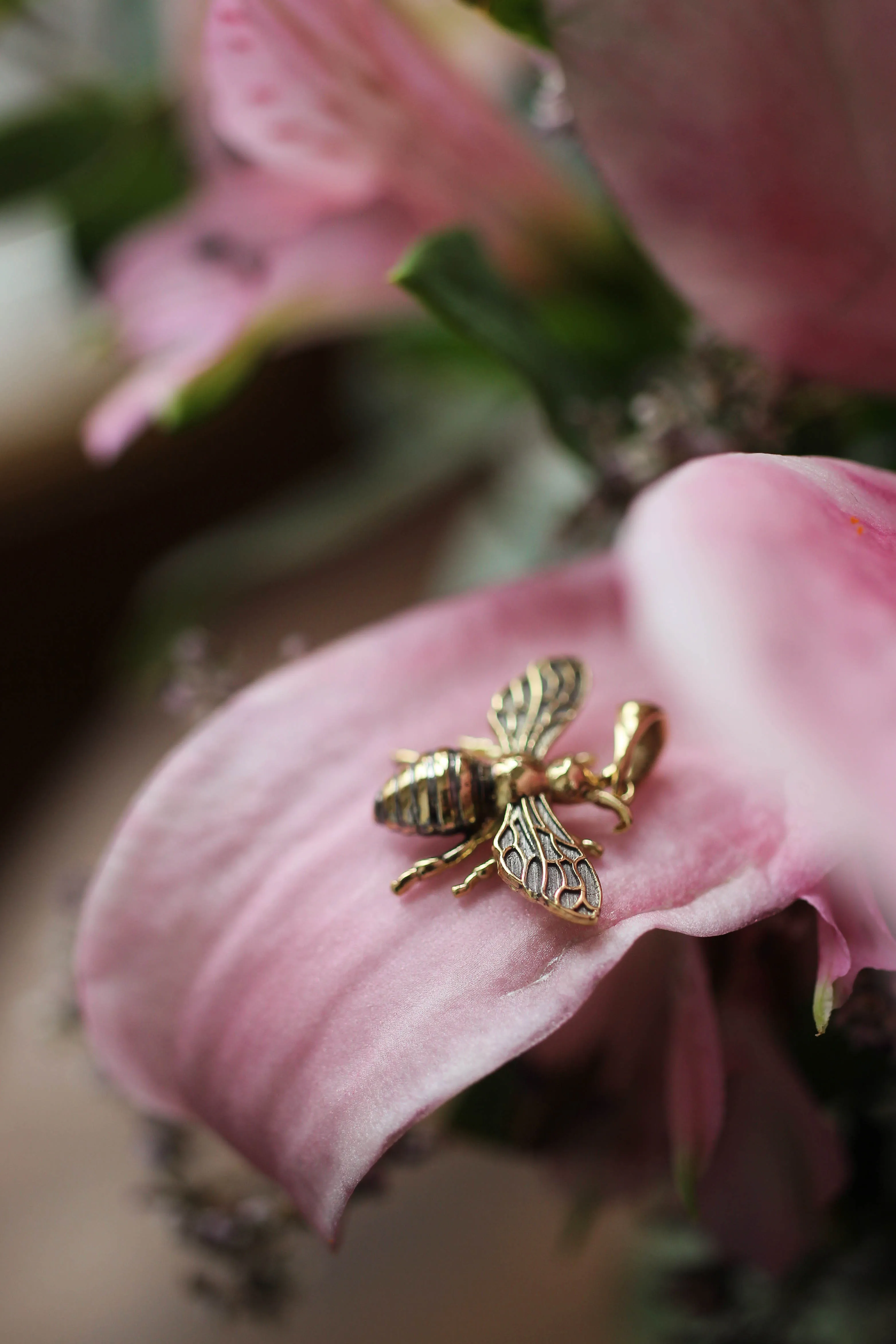 Gold bee pendant