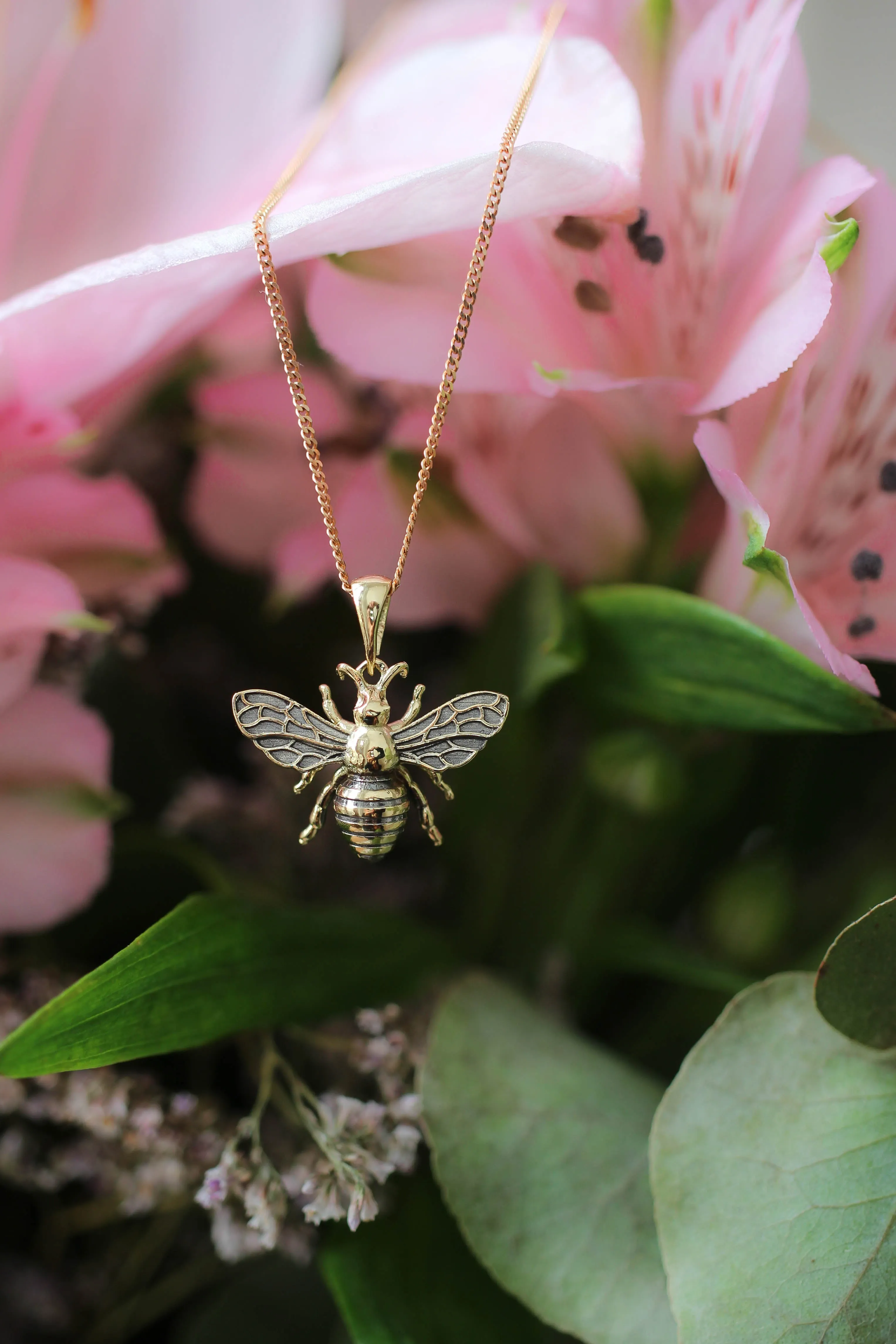 Gold bee pendant