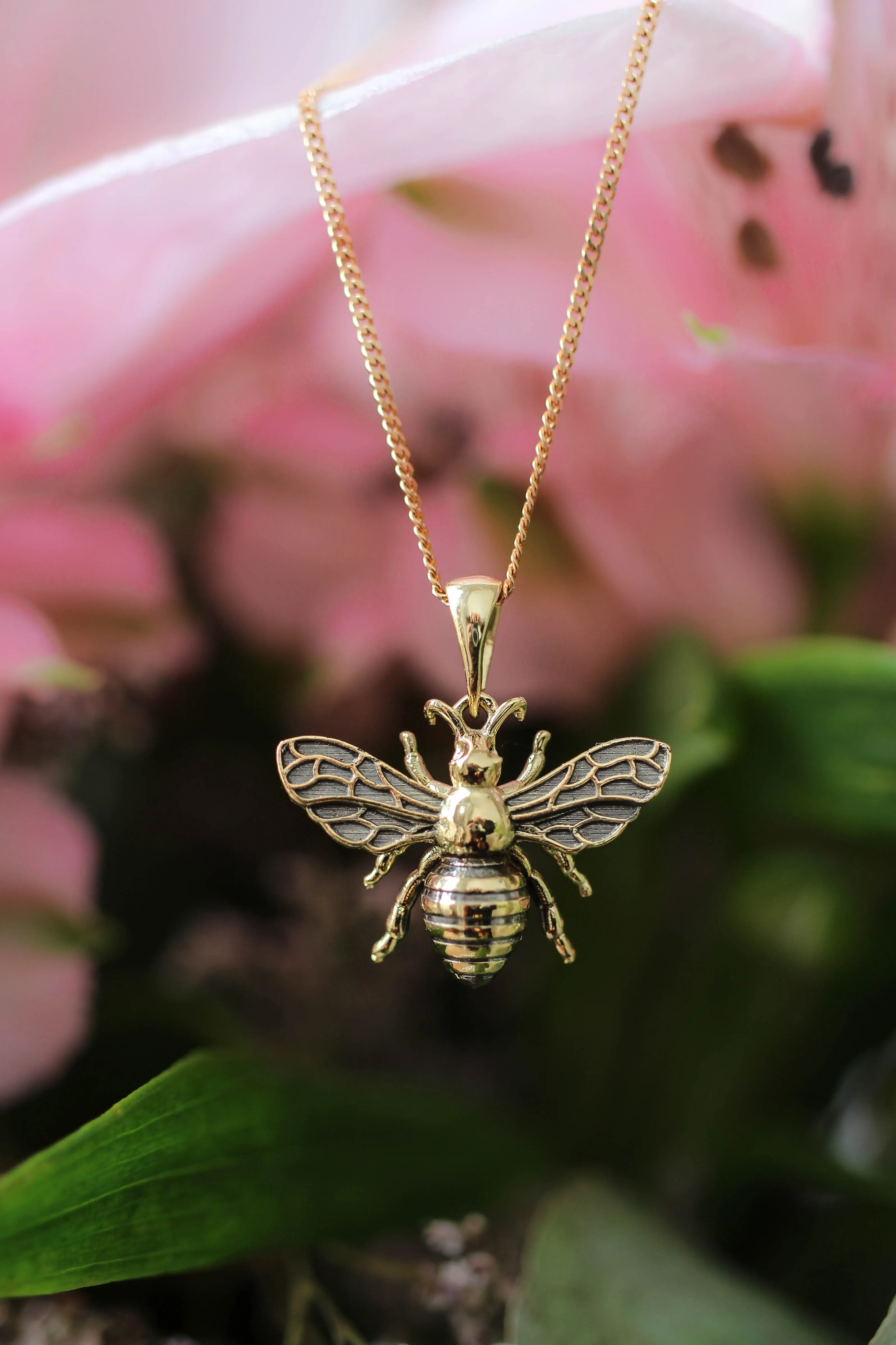 Gold bee pendant