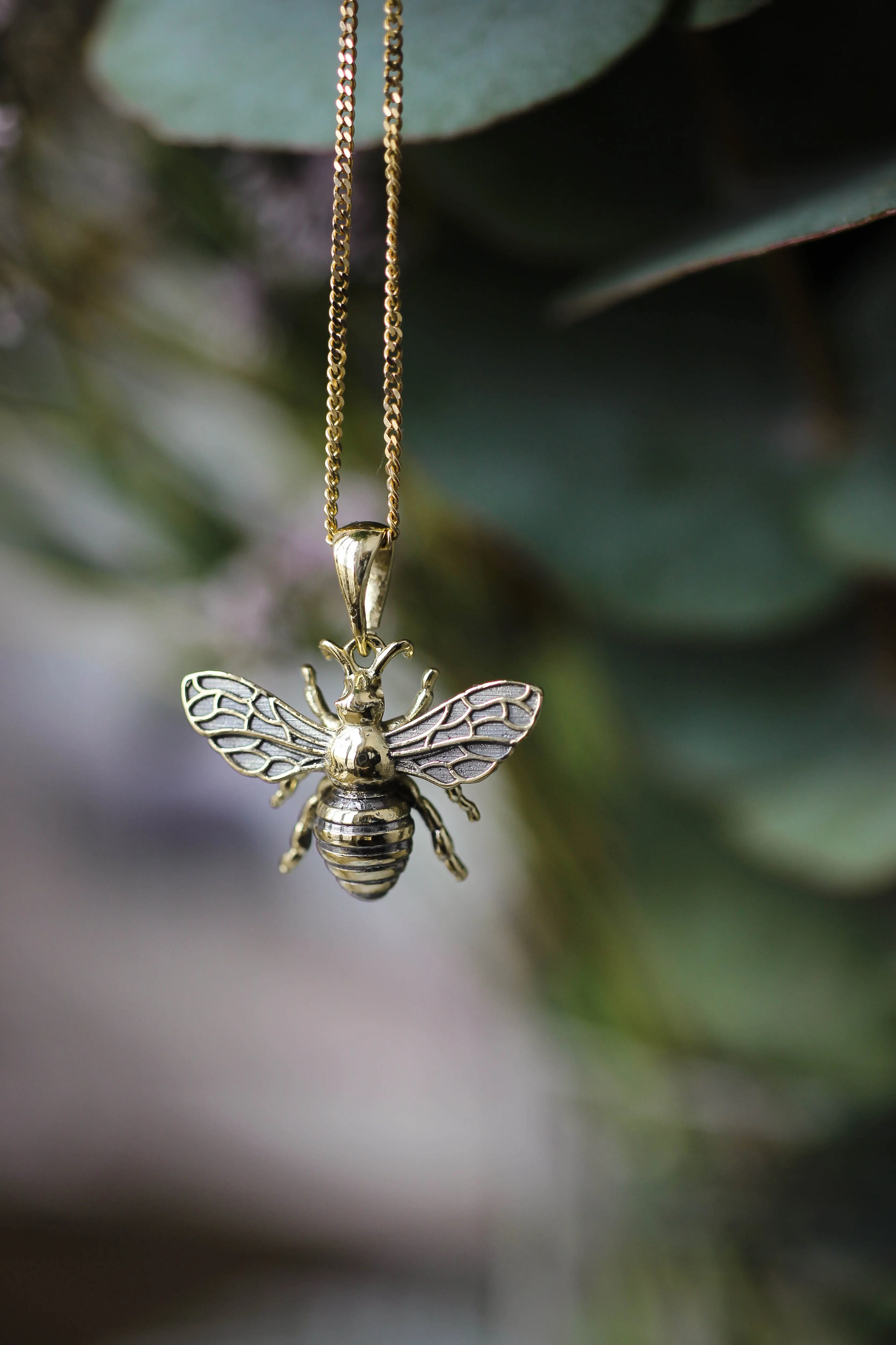 Gold bee pendant